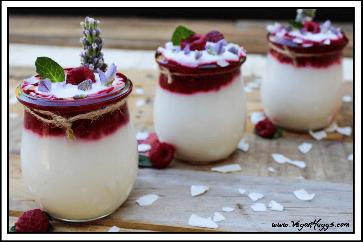 3 jars of yogurt on a table with coconut flakes on the side. 