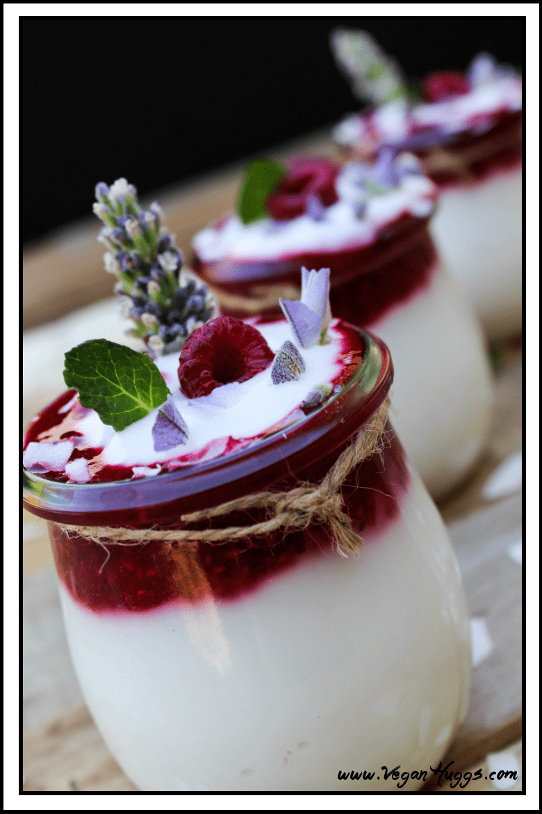 Side view of coconut yogurt in a jar. Two jars in the back. 