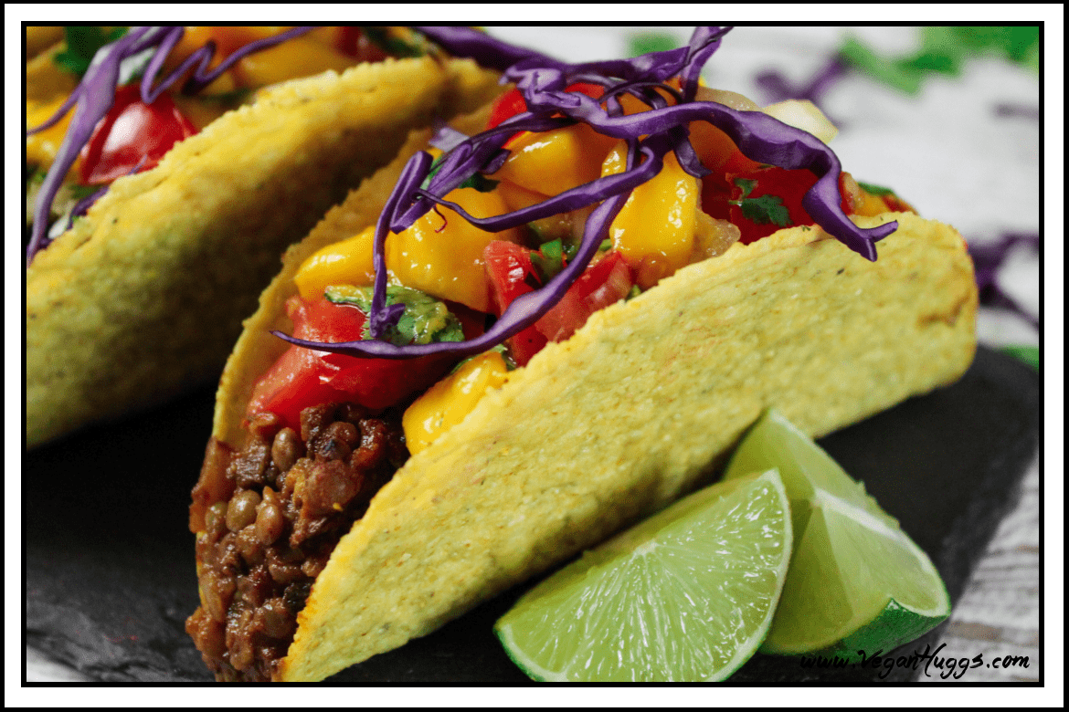 Side view of fully assembled taco on a slate board. 