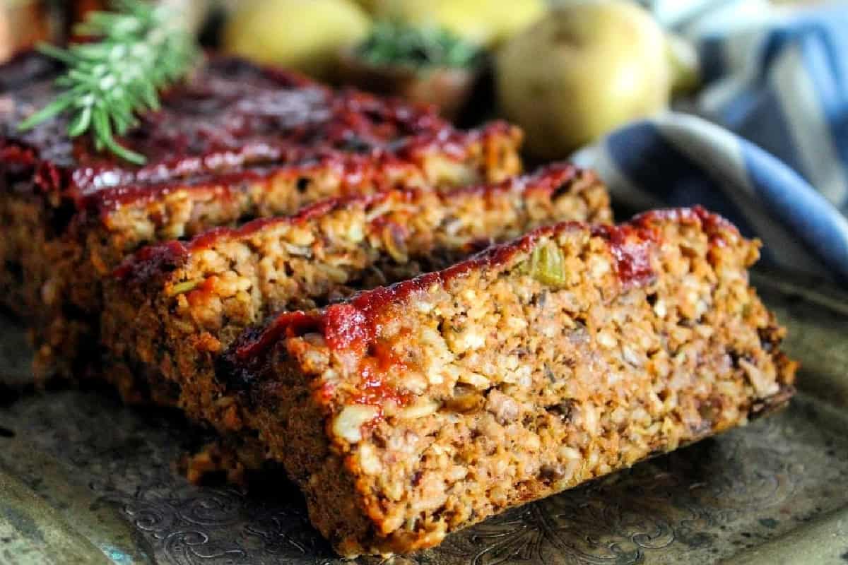 4 slices of vegan meatloaf on a platter.