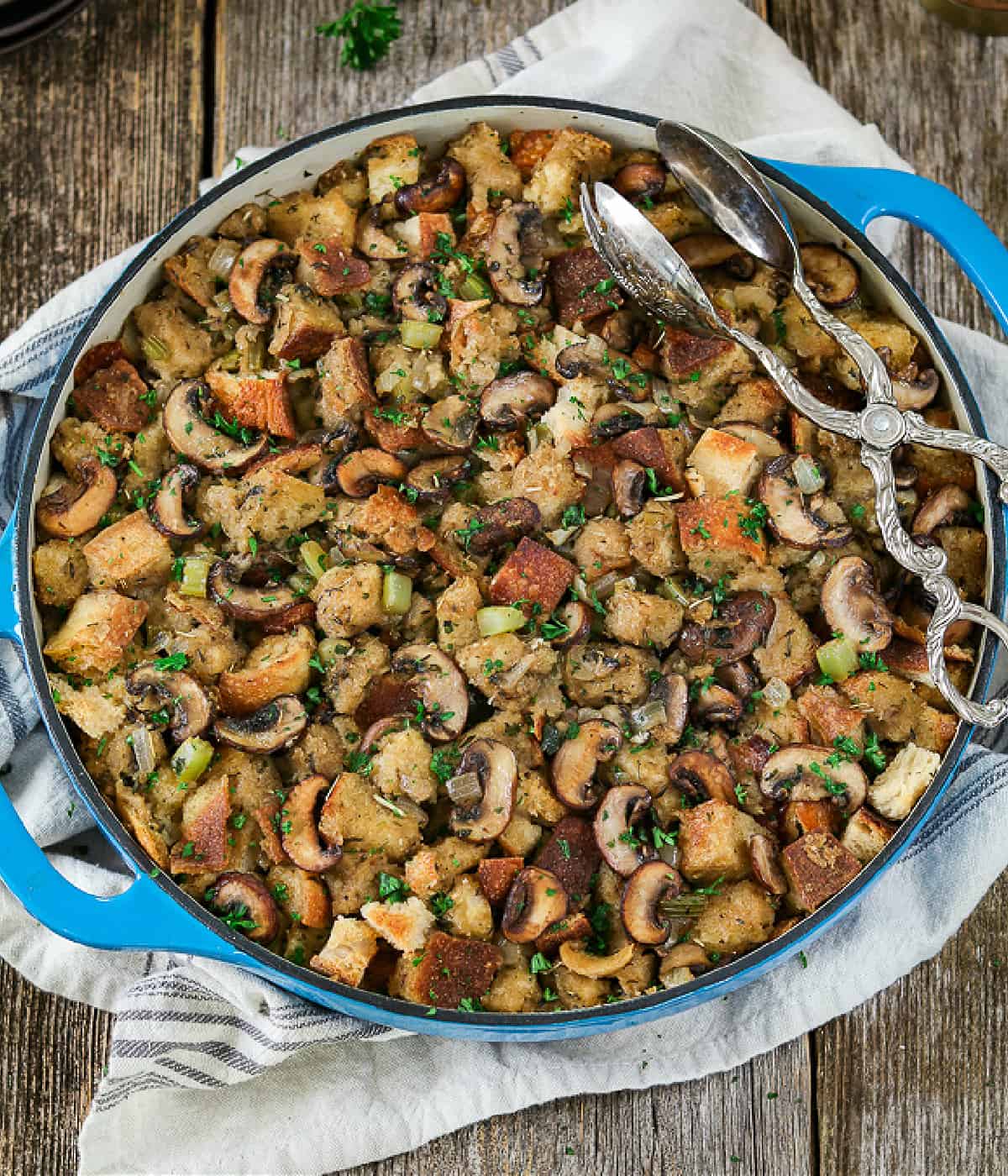 vegan stuffing in a blue casserole dish. 