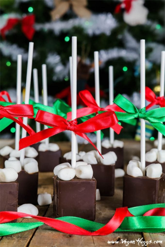 chocolate pieces topped with marshmallows on a table.