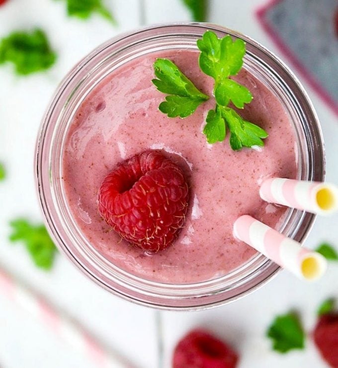 Close up view of banana berry smoothie in a glass. 