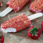 close up view of vegan strawberry ice cream bars on parchment paper.