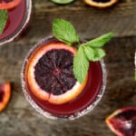 overhead view of a blood orange margarita toped with mint.