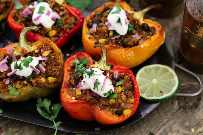 Closeup of red bell pepper stuffed with quinoa. 