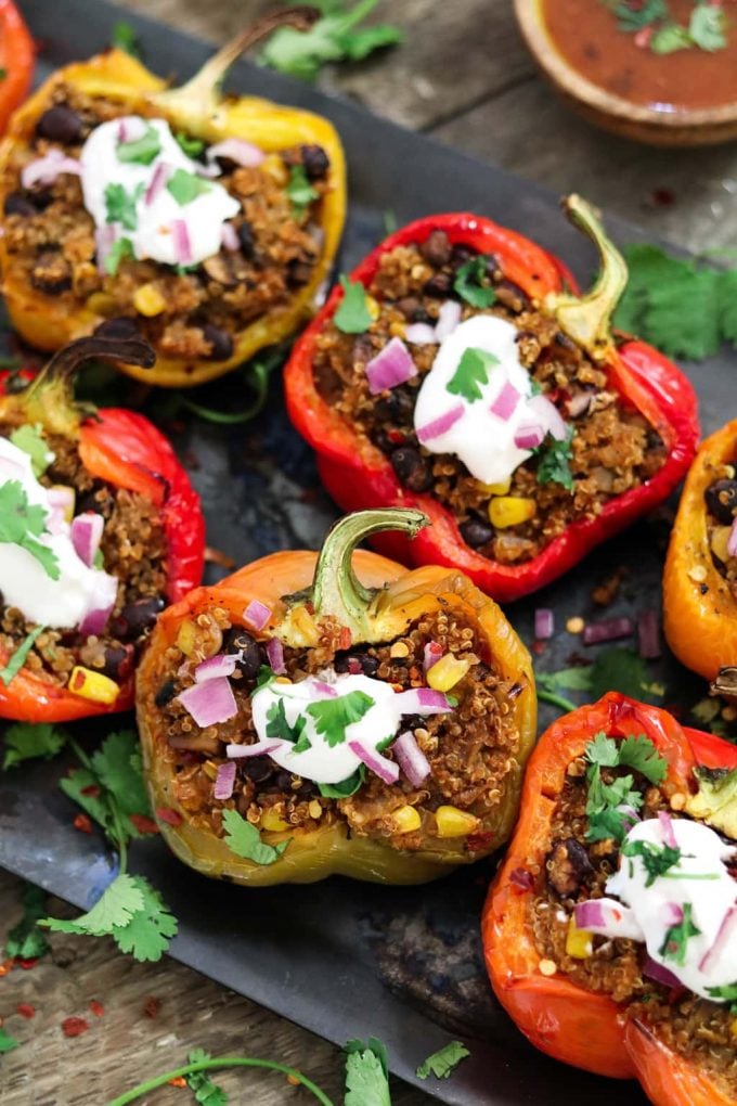 green, red and yellow bell peppers stuffed with quinoa. 