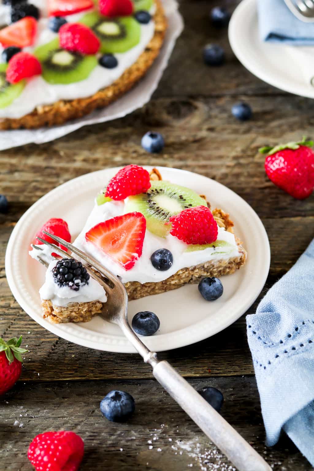 Slice on a plate with a fork in the middle. 