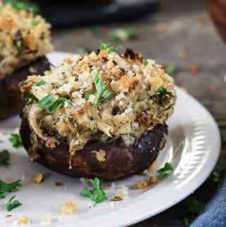 Closeup view of one fully baked crabless vegan stuffed mushrooms.