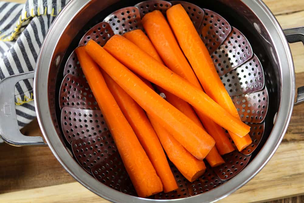 Carrots in a steamer basket. 