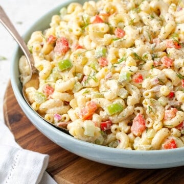 closeup view of fully assembled macaroni salad in a bowl.