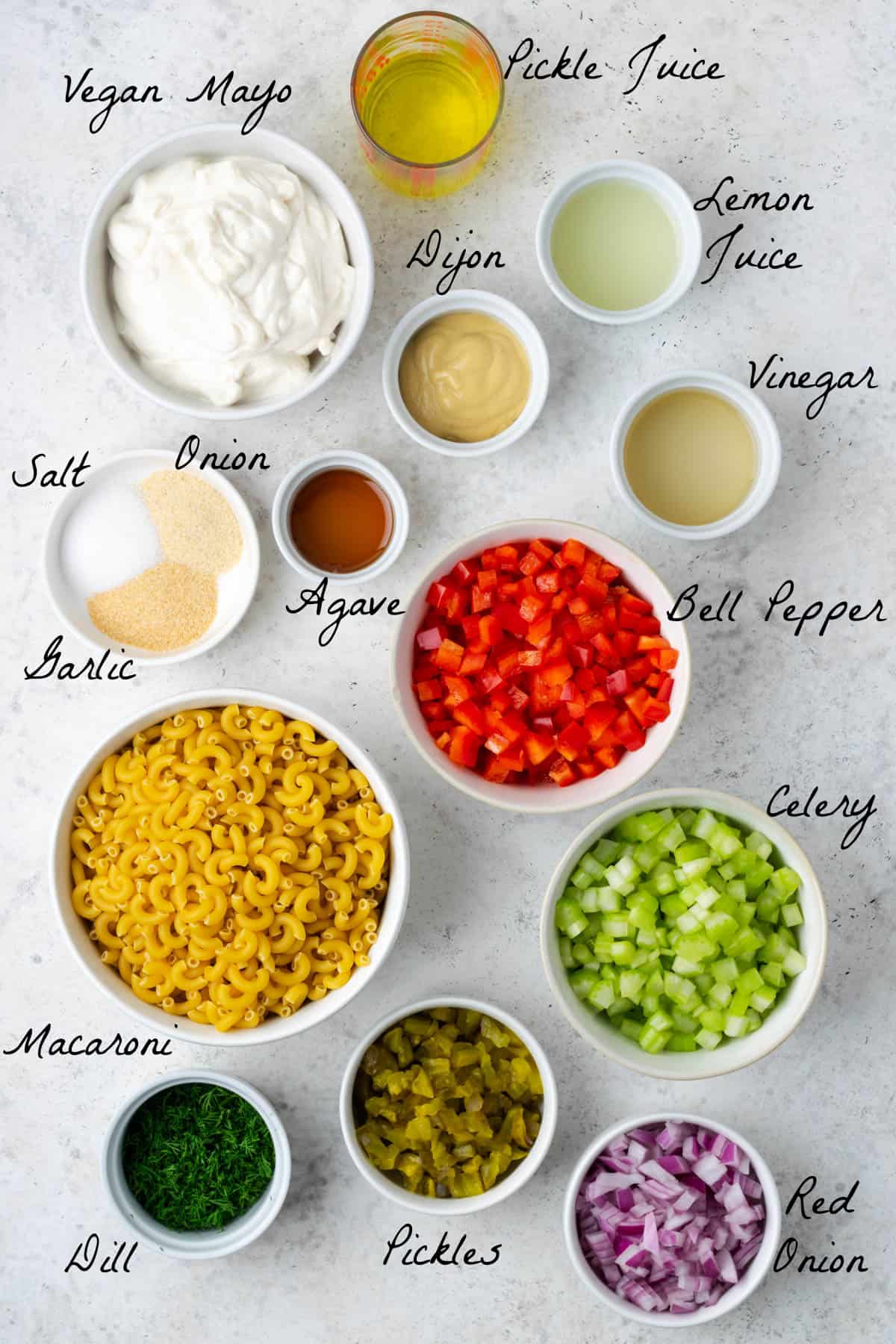 Ingredients to make the macaroni and dressing on a table top. 