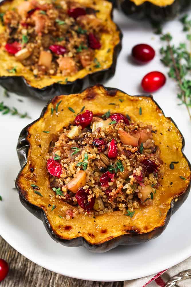 Close up photo of acorn squash that is stuffed and fully baked.