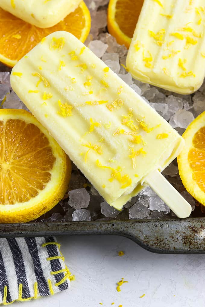 Close up view of orange creamsicle pops.