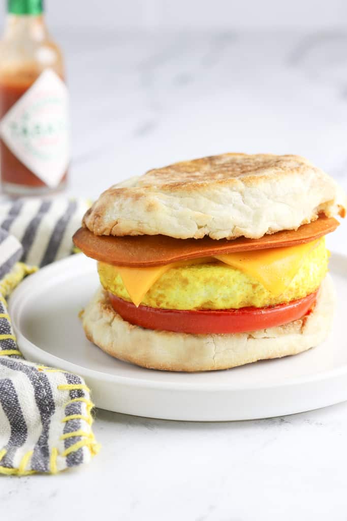 Side view of a fully assembled vegan breakfast sandwich.