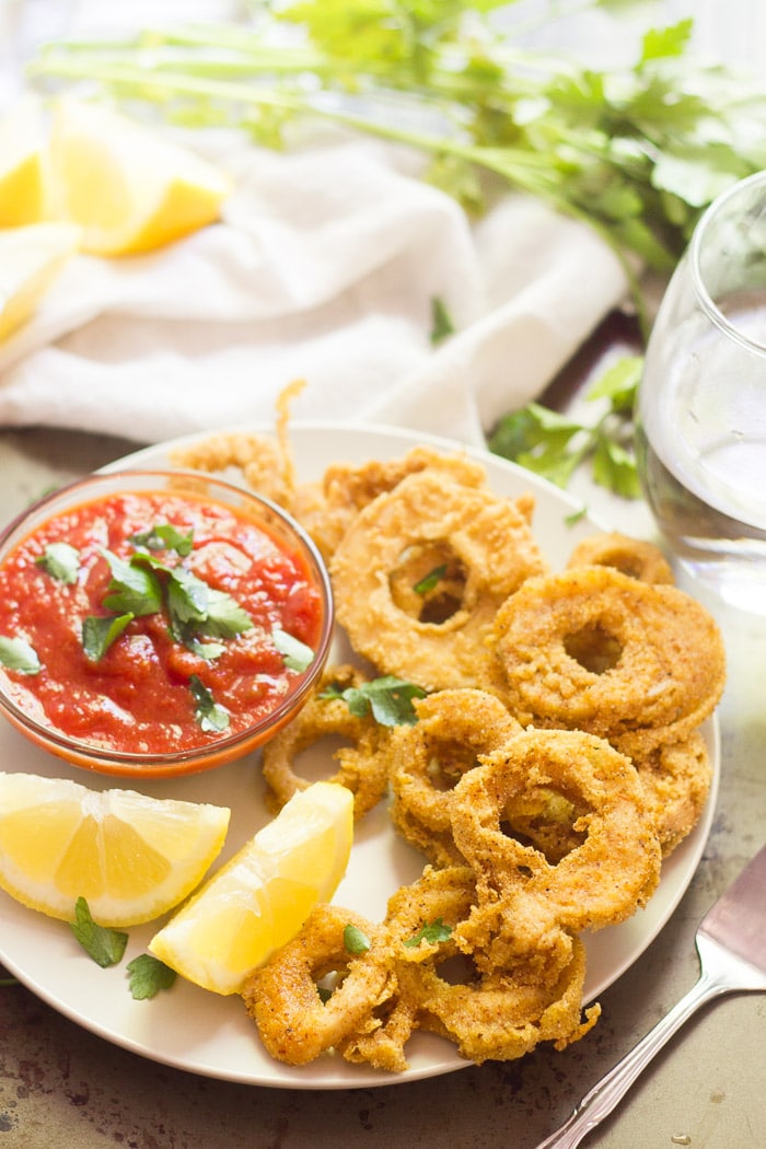 vegan calamari on a plate with lemons for vegan valentine's day recipes collage.