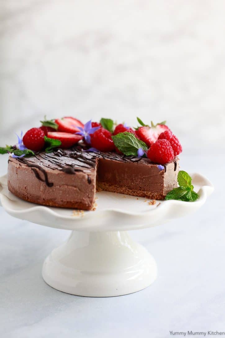 chocolate cake on a cake stand for vegan valentine's day recipes