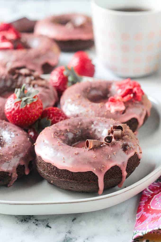 vegan donuts on a white plate for vegan valentine's day recipes.