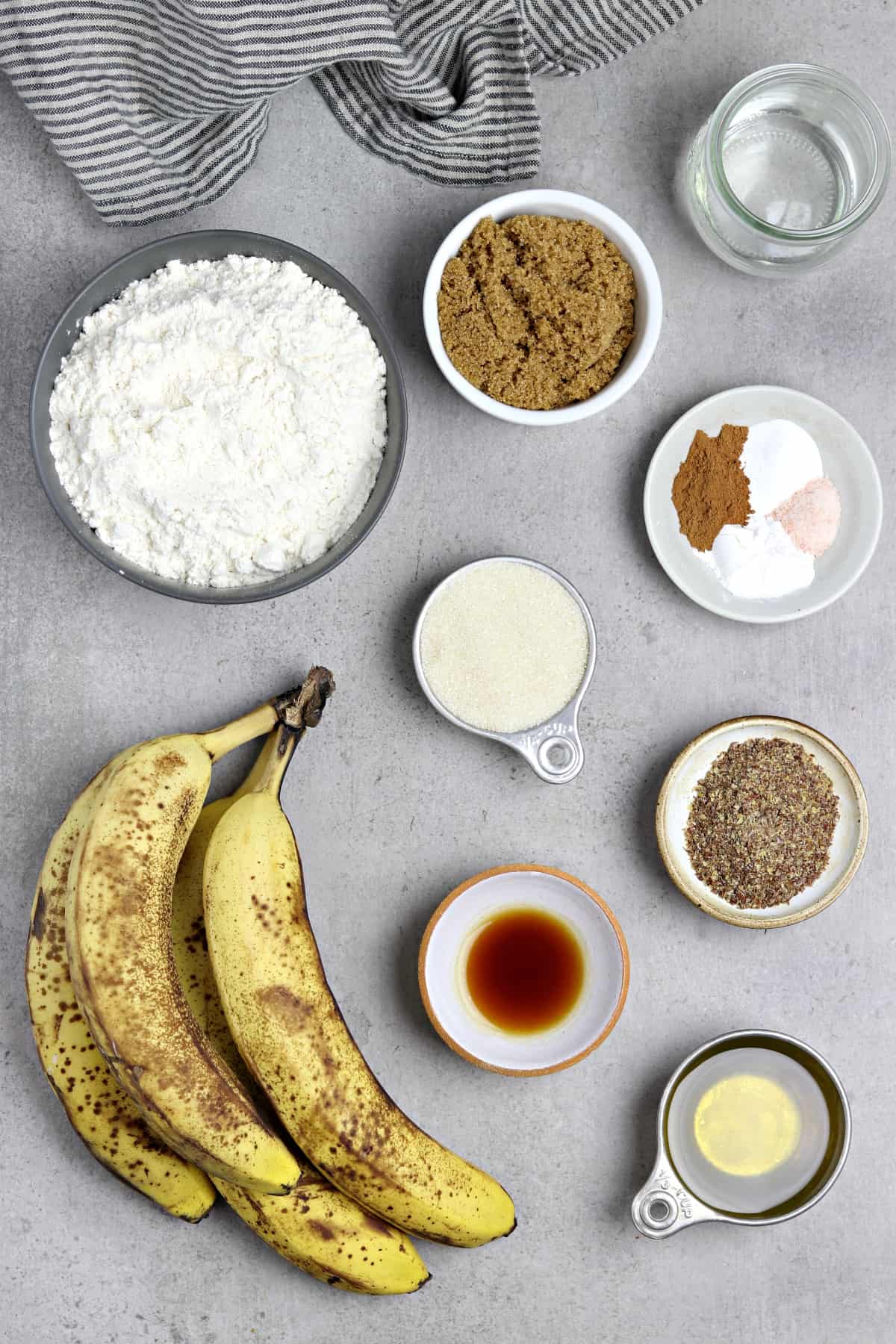 Ingredients to make banana bread on a table top. 