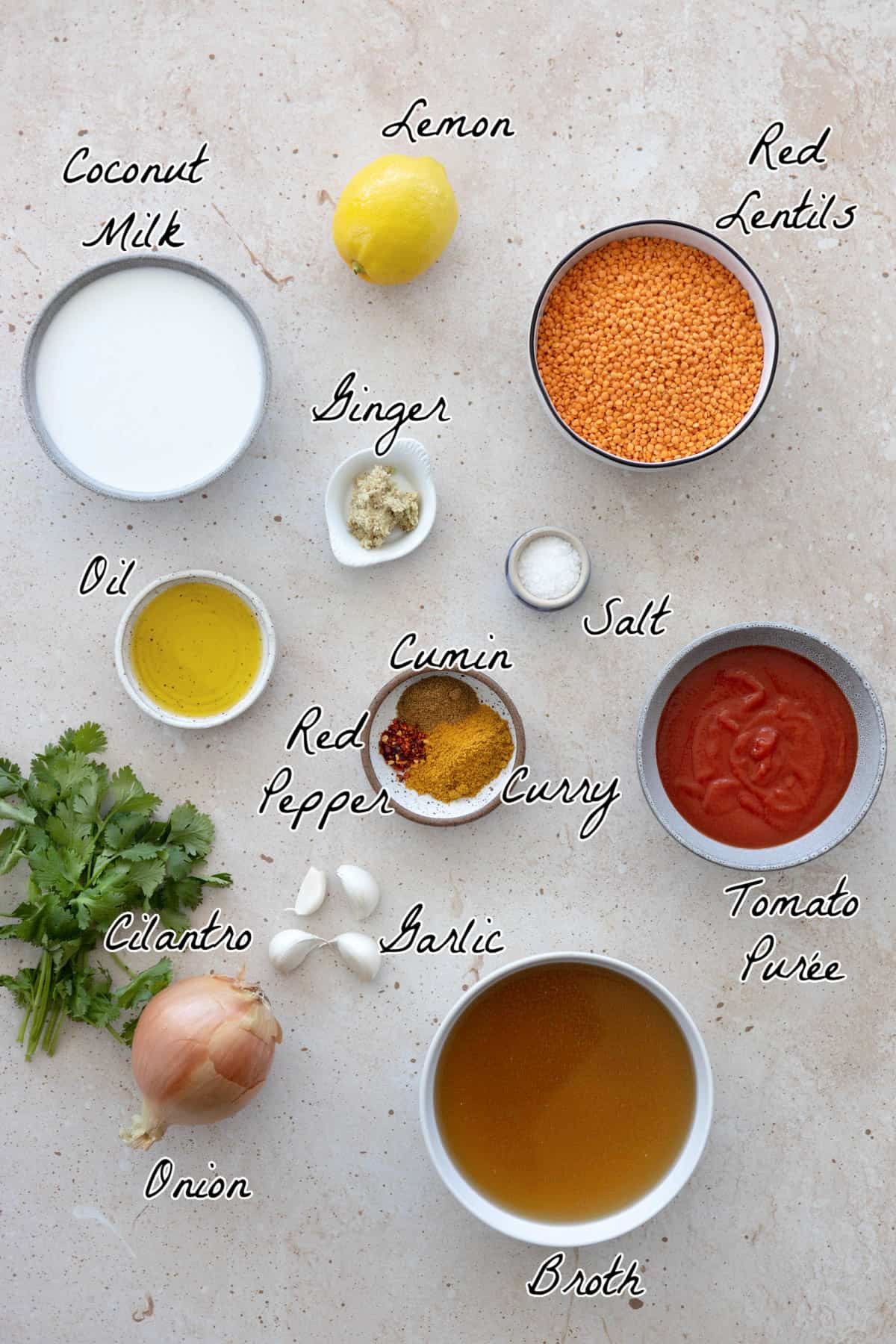 All ingredients to make dahl on a table top.