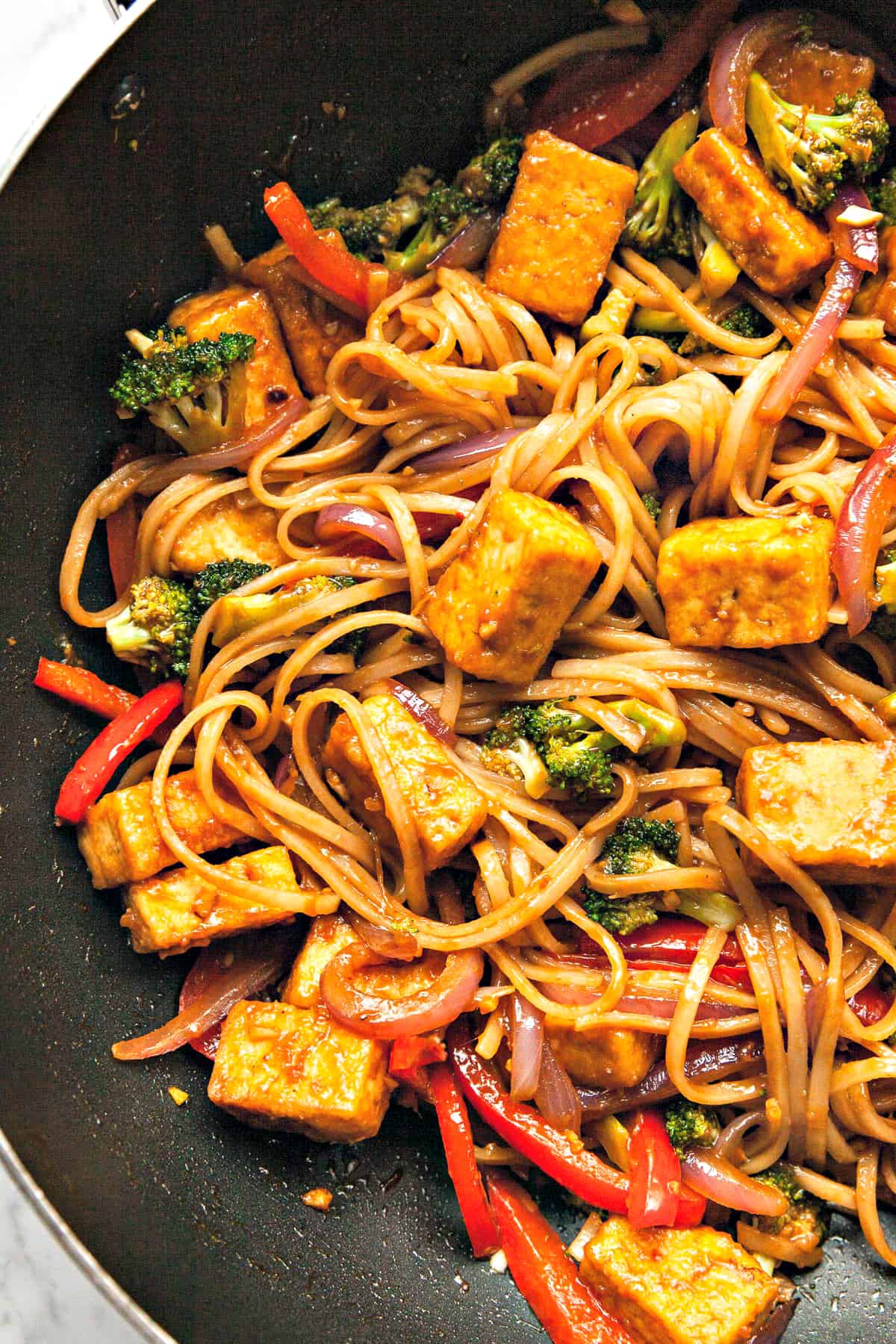 Close up view of fully cooked stir fry in a wok.
