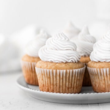 vegan vanilla cupcakes on a plate.