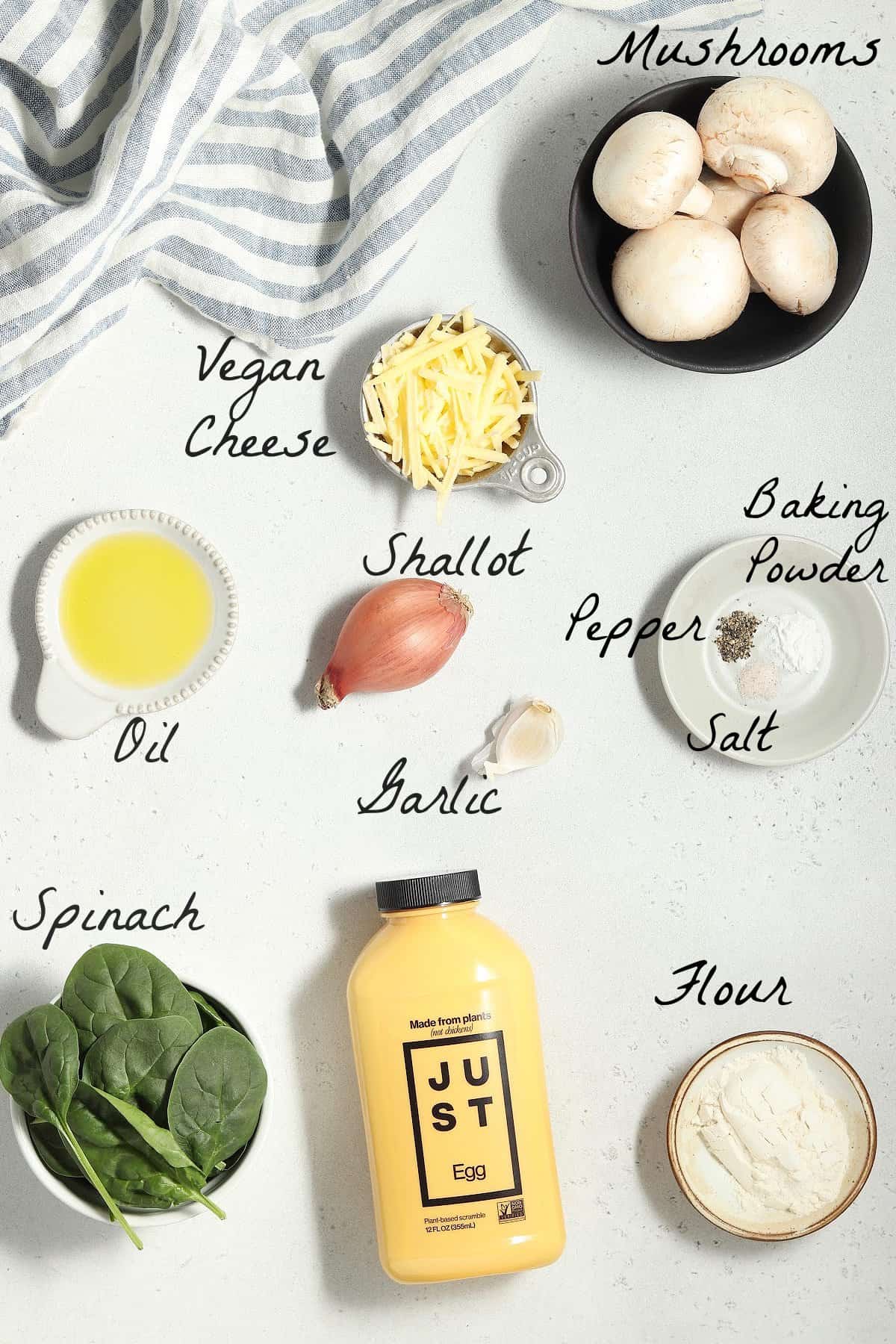 All of the ingredients to make the omelet on a stone table top. 