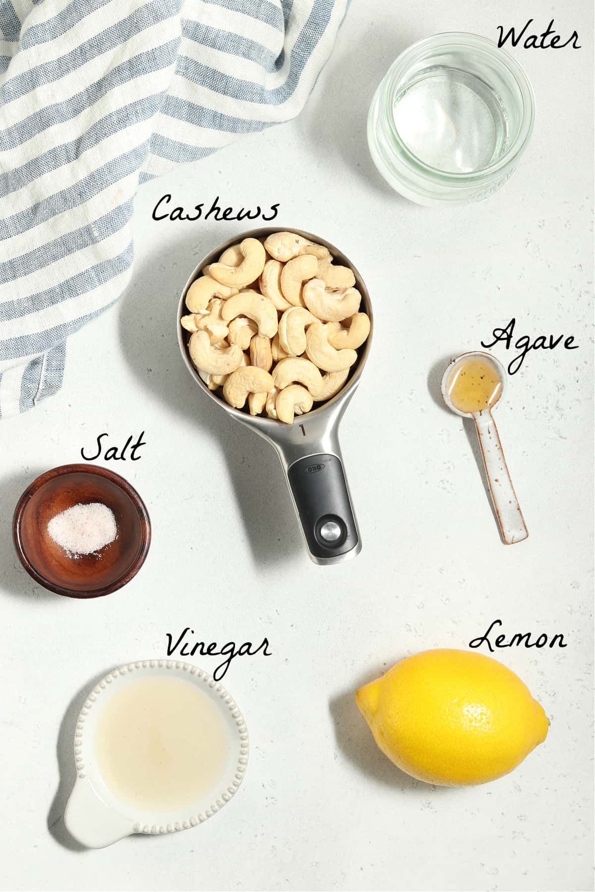 All ingredients to make mayo on a stone table top. 