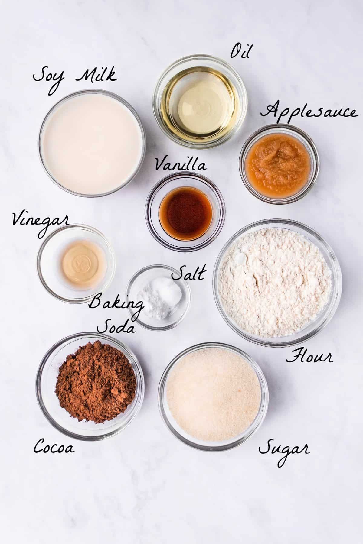 Ingredients to make cupcakes on a marble table top