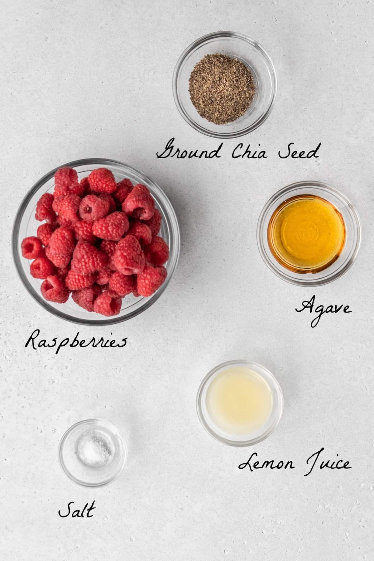Ingredients to make jam on a stone table top.