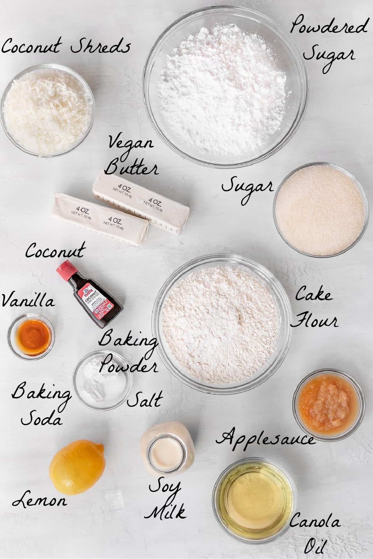 all ingredients to make the coconut cake on a table top.
