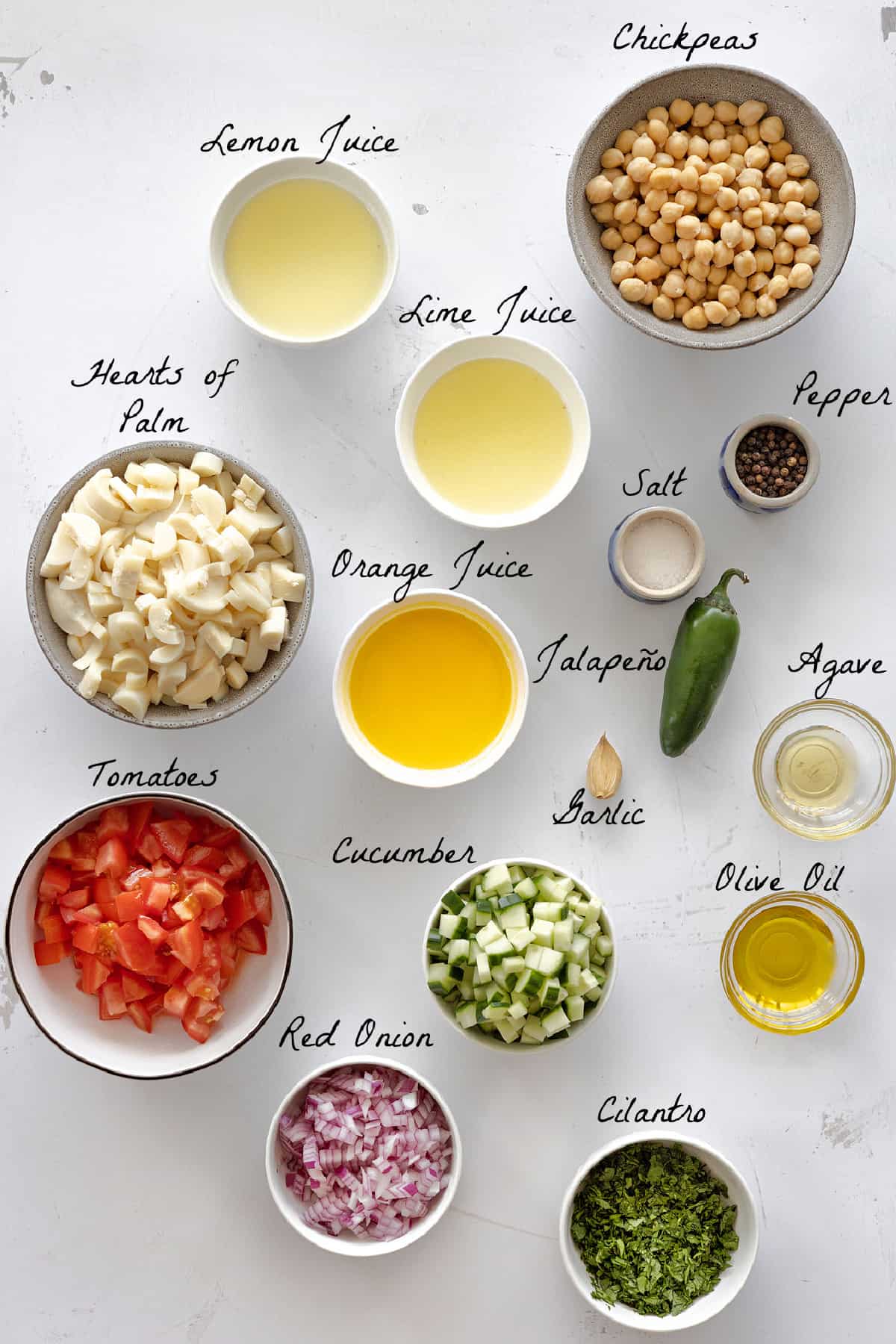 All ingredients to make the salad on a white table top. 