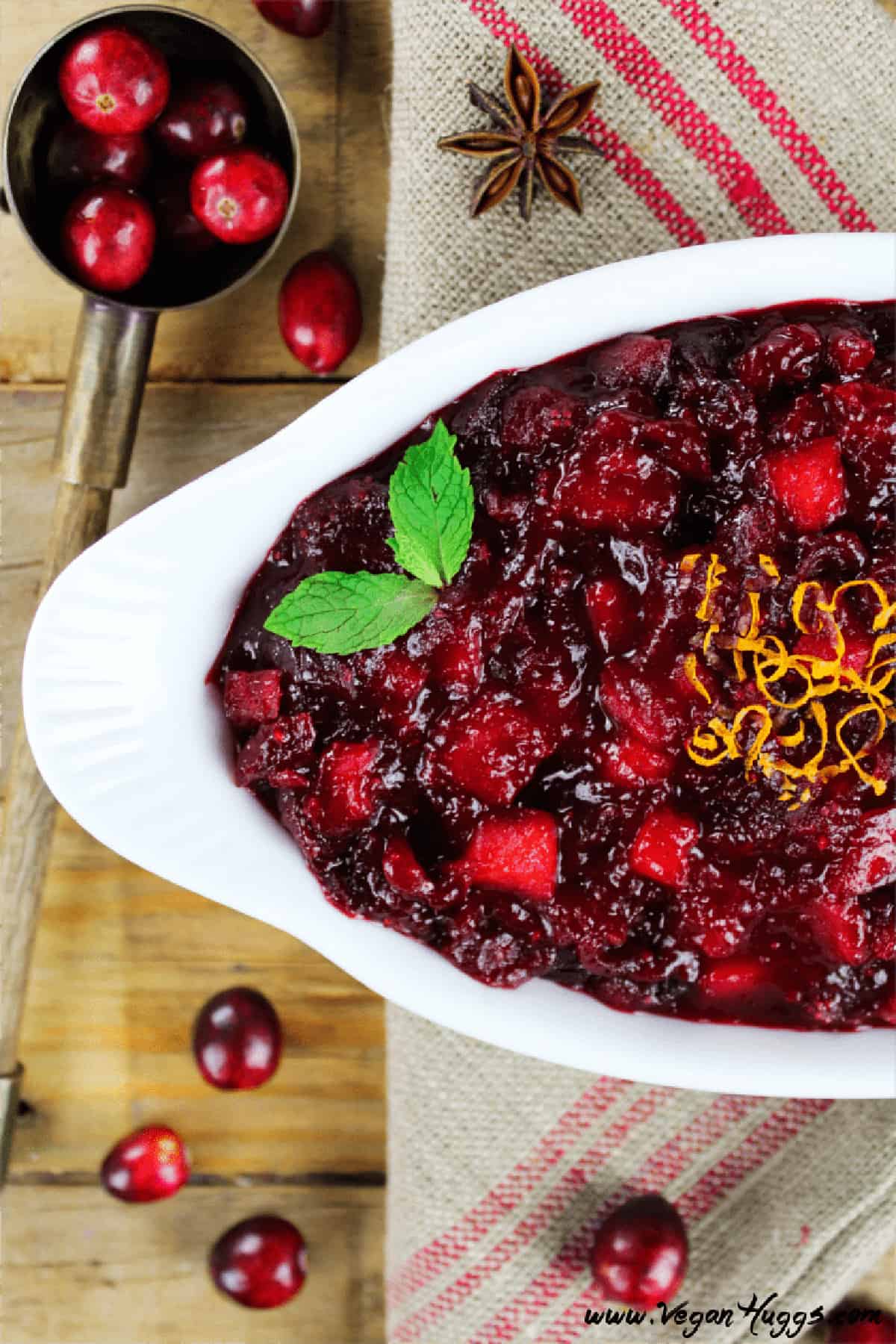 Closeup view of vegan cranberry sauce in a white dish.