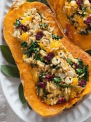 close up view of stuffed butternut squash on a serving platter.