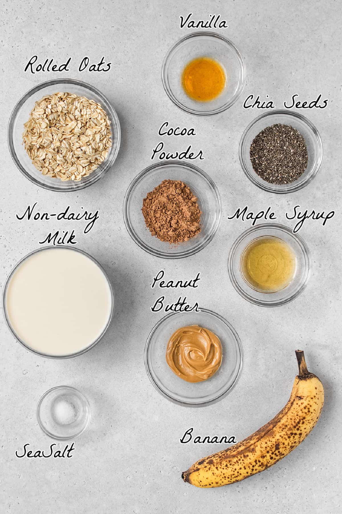 Ingredients to make overnight oats on a stone table top. 
