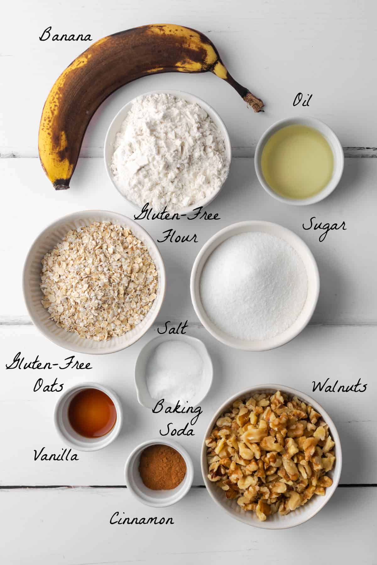 Ingredients to make banana oatmeal cookies on a white table. 