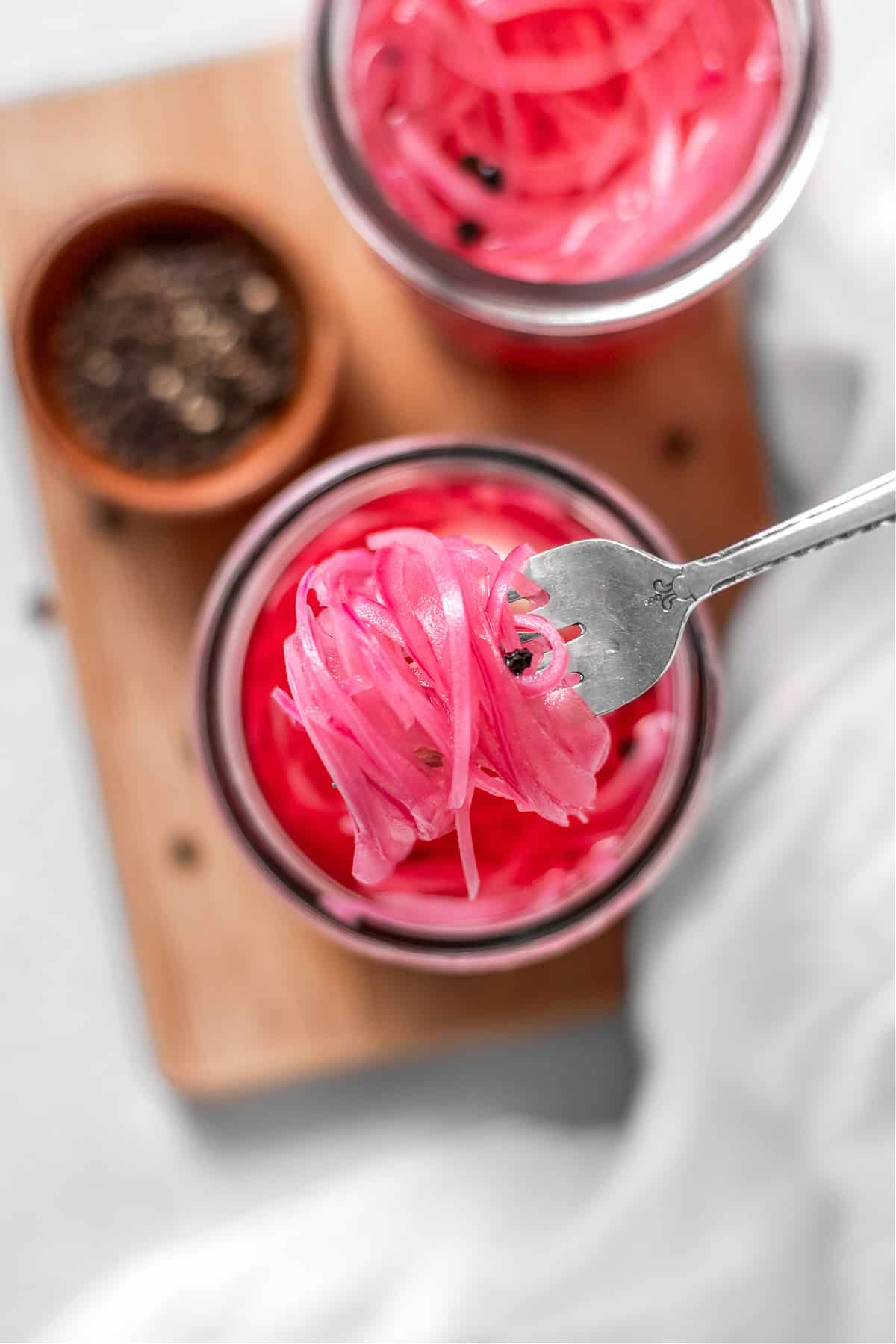 Add a tangy twist to your meals with these Quick Pickled Red Onions! This vibrant and zesty condiment is the perfect addition to sandwiches, salads, tacos, soups, and more
