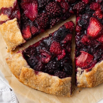 overhead shot of a freshly baked berry galette on a plate.