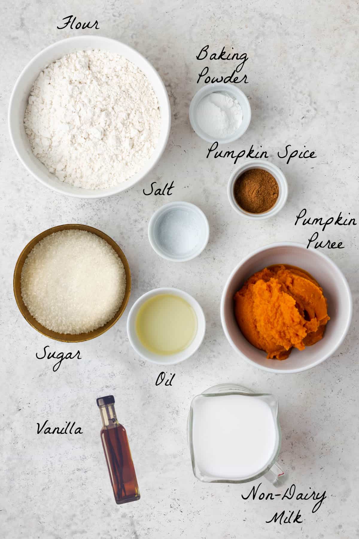 Ingredients to make the pancake batter on a stone table top.