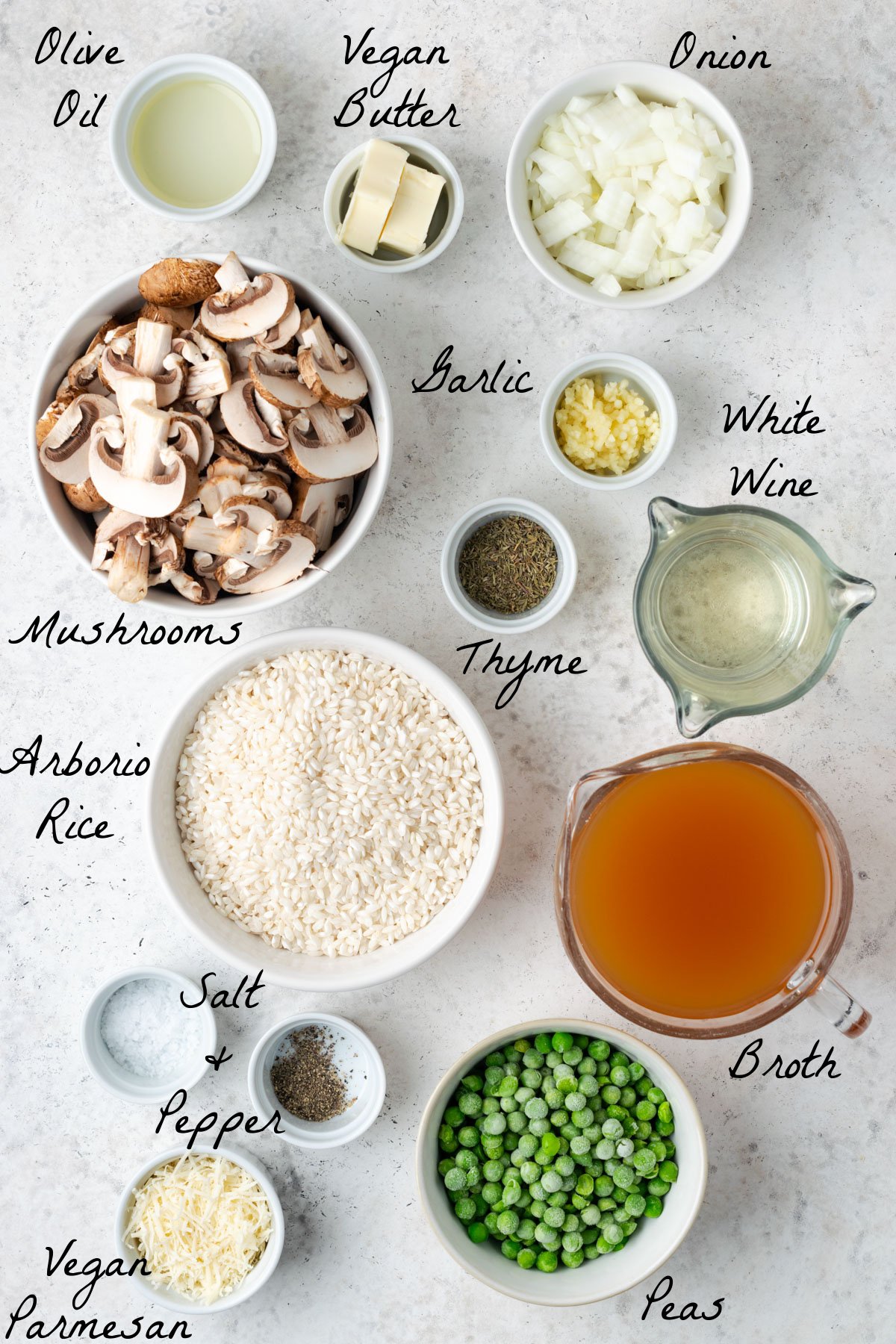 Ingredients to make risotto on a stone table top. 