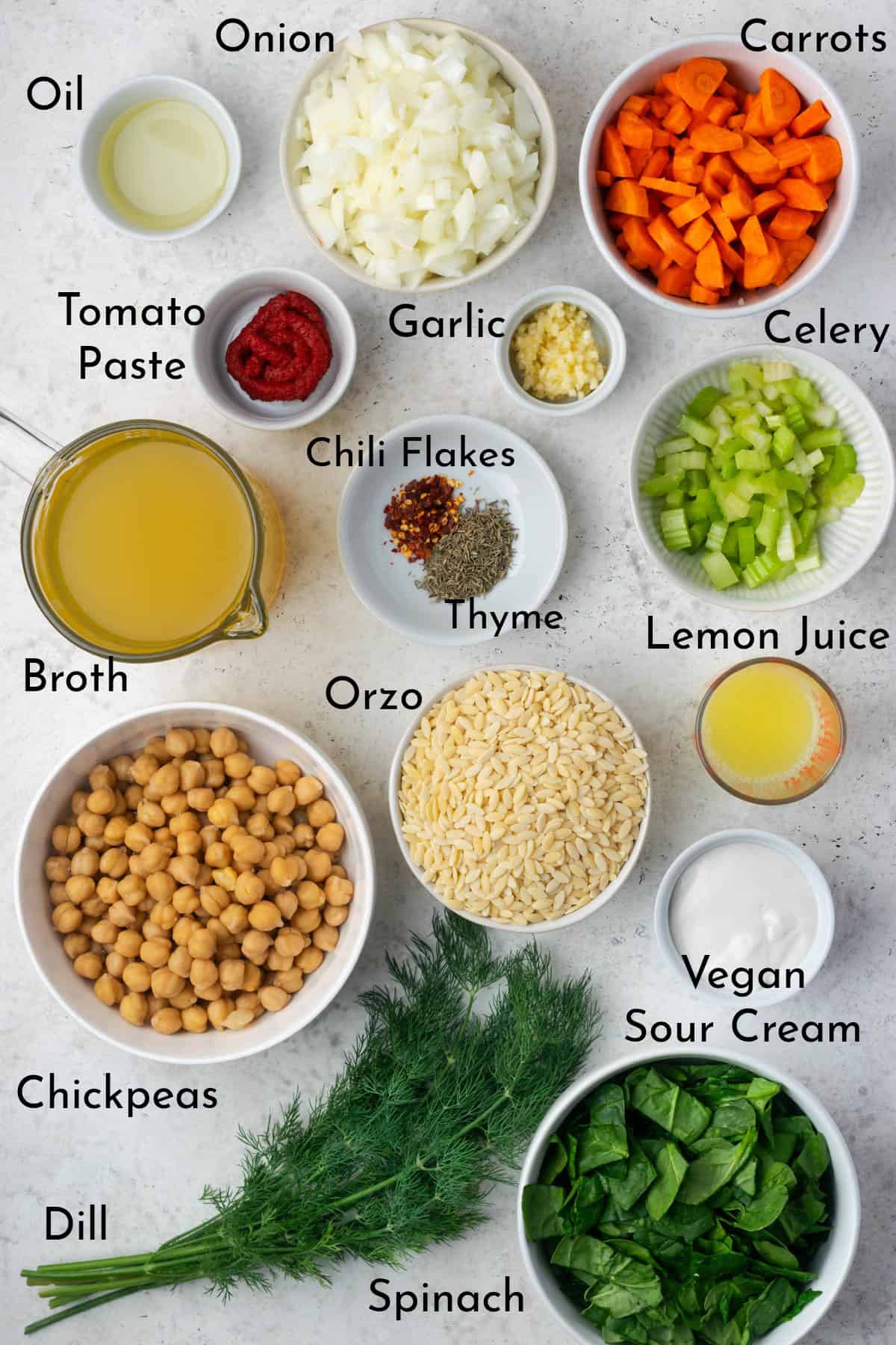 Ingredients to make the soup recipe displayed on a stone table top.
