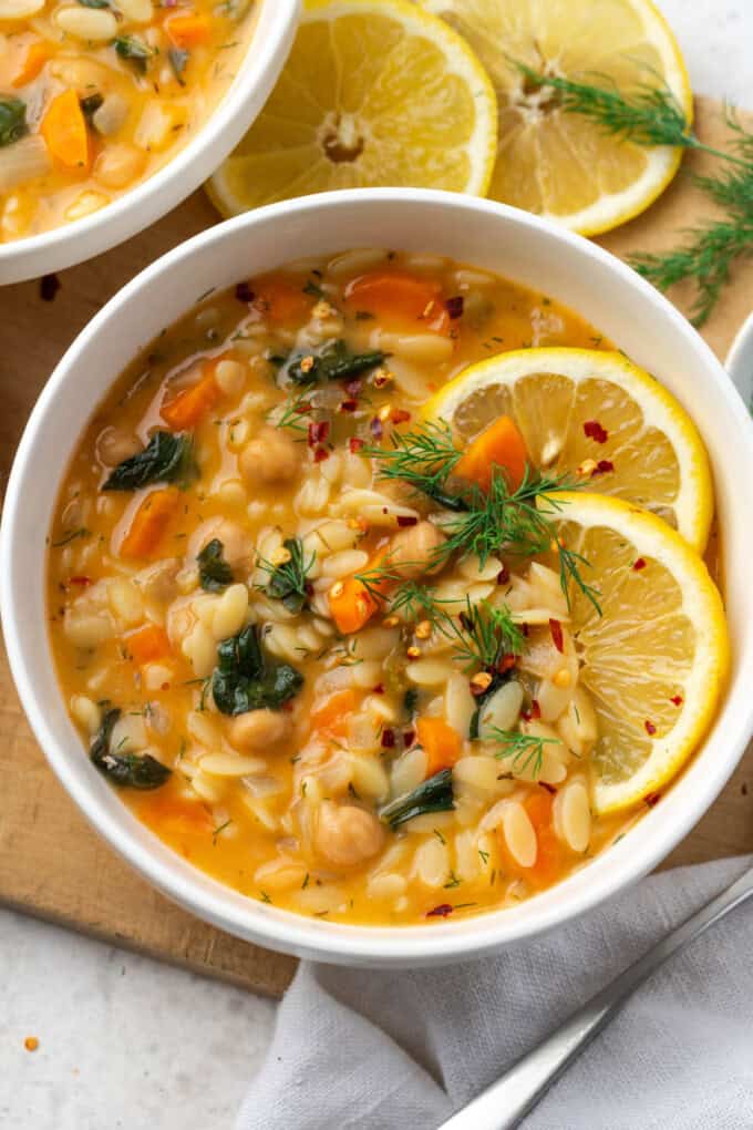 Bowl of soup on cutting board.