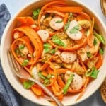 carrot salad in a a white bowl.