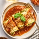 vegan zucchini rollatini on a plate.
