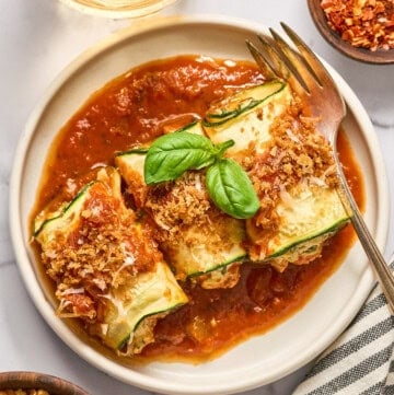 vegan zucchini rollatini on a plate.
