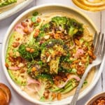 overhead view of vegan broccoli salad on a plate with fork on the side.