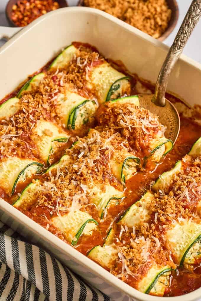 zucchini rolls in a casserole dish.
