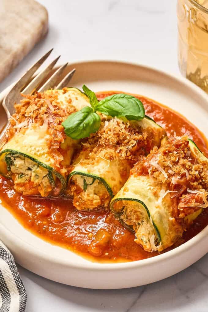 zucchini on a plate with sauce.