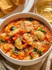 bowl of butter bean stew with bread on the side.