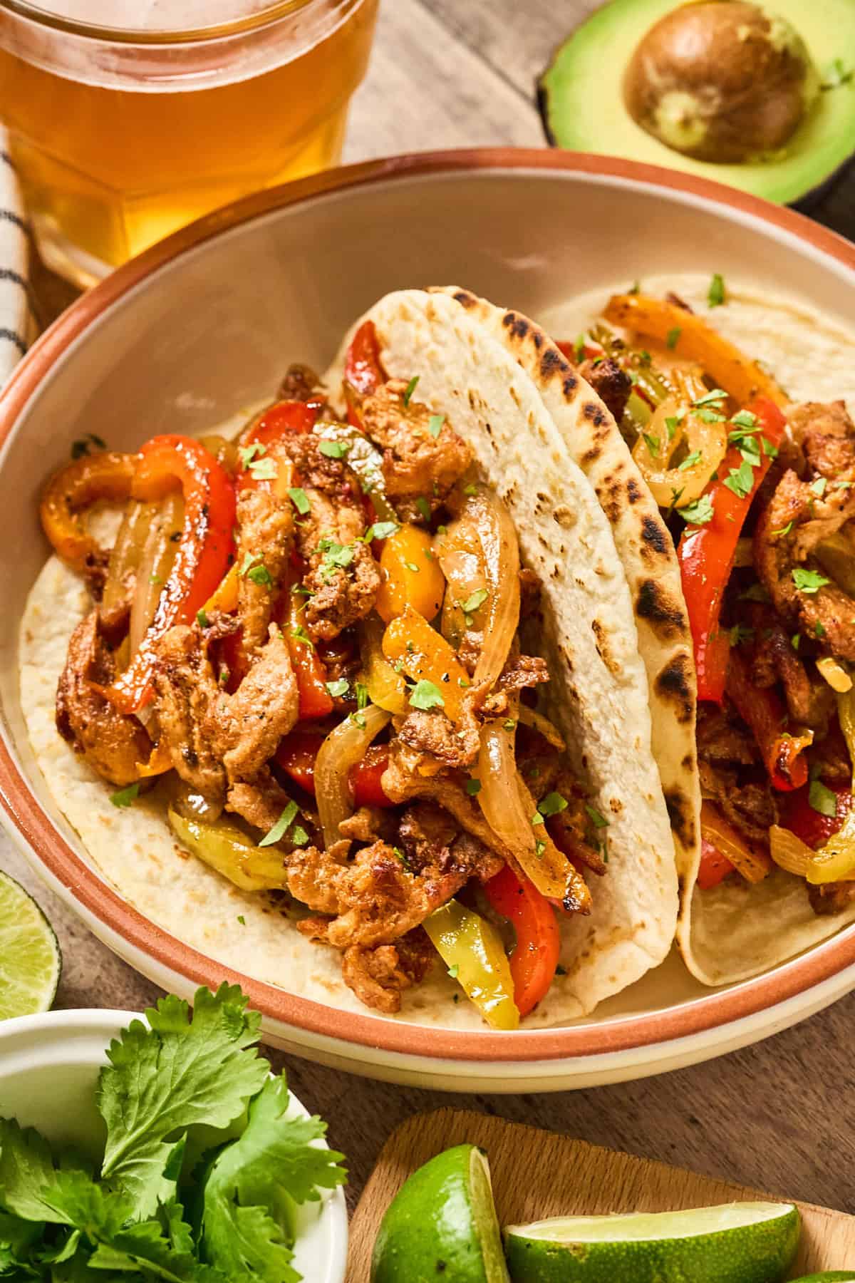 Close up view of vegan sheet pan fajitas in a bowl.